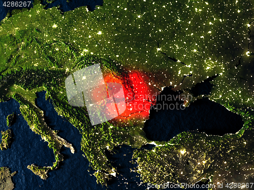 Image of Romania in red from space at night