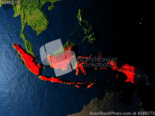 Image of Indonesia in red from space at night