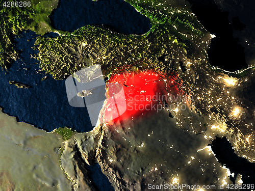 Image of Syria in red from space at night