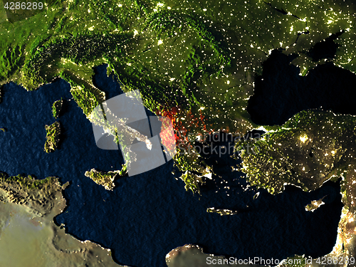 Image of Albania in red from space at night