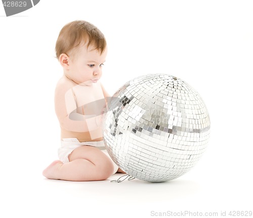 Image of adorable baby boy with big disco ball