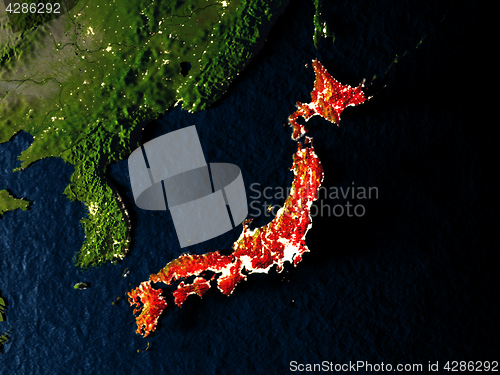 Image of Japan in red from space at night