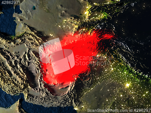 Image of Afghanistan in red from space at night