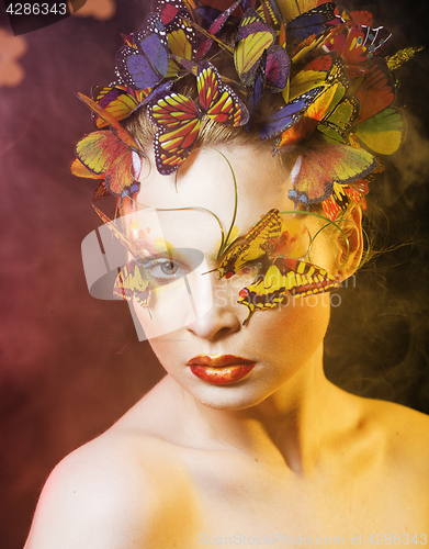 Image of woman with summer creative make up like fairy butterfly closeup 