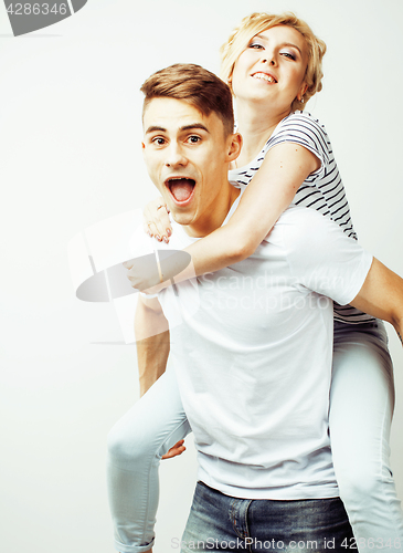 Image of young pretty teenage couple, hipster guy with his girlfriend happy smiling and hugging isolated on white background, lifestyle people concept