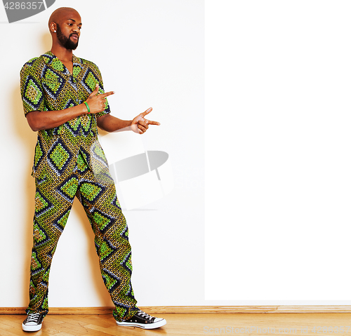 Image of portrait of young handsome african man wearing bright green nati