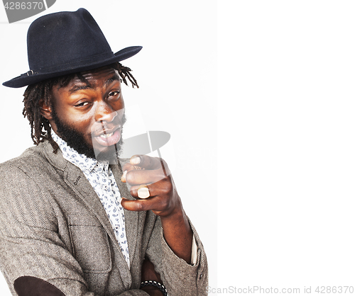 Image of young handsome afro american boy in stylish hipster hat gesturin