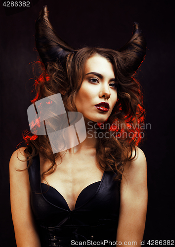 Image of bright mysterious woman with horn hair, halloween celebration