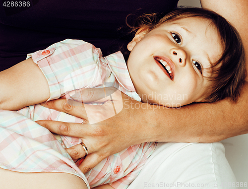 Image of young pretty stylish mother with little cute blond daughter hugging, happy smiling real family, lifestyle people concept