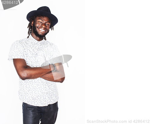 Image of young handsome afro american boy in stylish hipster hat gesturin