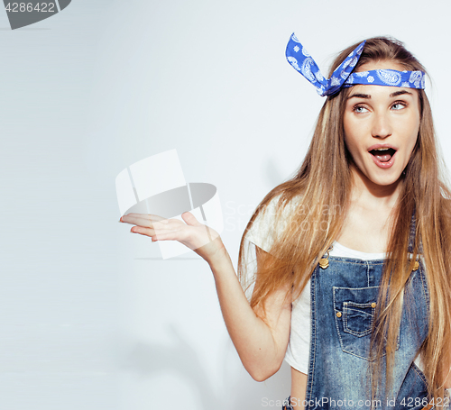 Image of young pretty teenage hipster girl posing emotional happy smiling on white background, lifestyle people concept 
