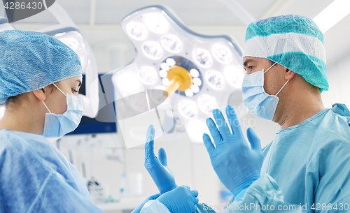 Image of surgeons in operating room at hospital