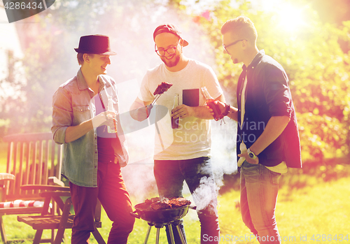 Image of friends drinking beer at summer barbecue party