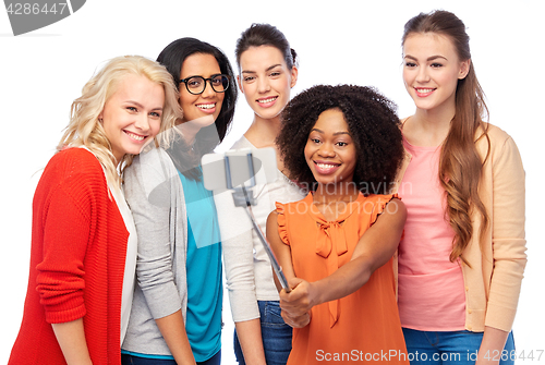 Image of international group of happy women taking selfie