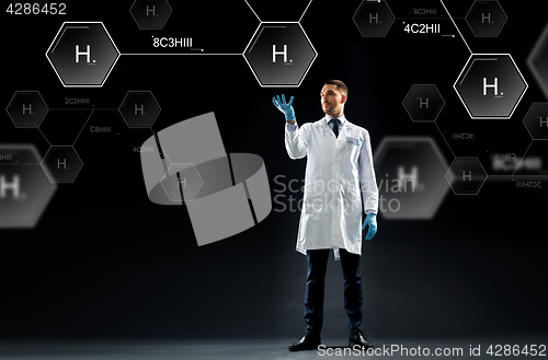 Image of scientist with virtual chemical formula projection