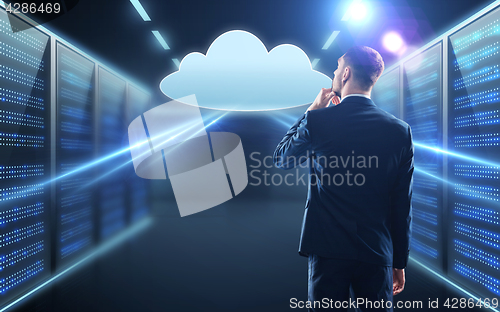 Image of businessman looking at virtual cloud hologram