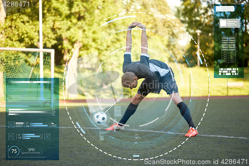 Image of soccer player stretching leg on field football