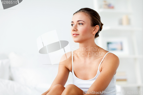 Image of beautiful happy young woman at home