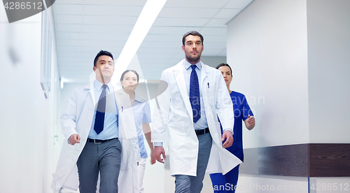 Image of group of medics walking along hospital