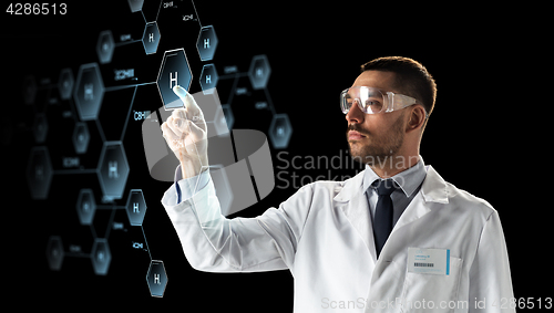Image of scientist in goggles with chemical formula