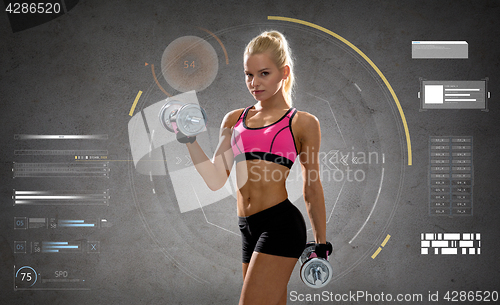 Image of happy young sporty woman exercising with dumbbells