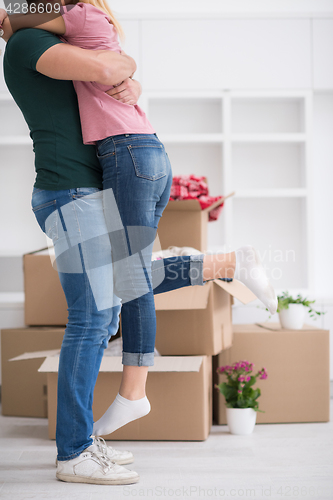 Image of happy Young couple moving in new house