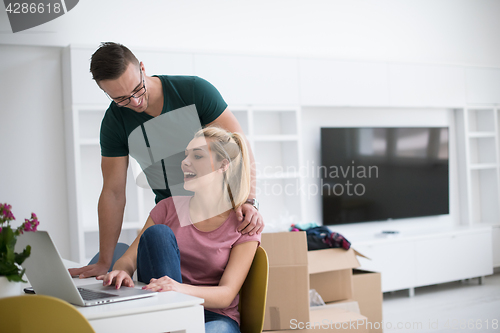 Image of Young couple moving in a new home