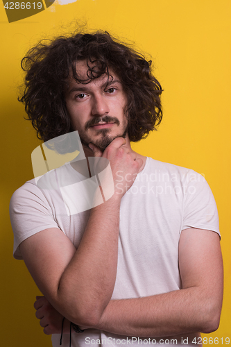 Image of young man with funny hair over color background