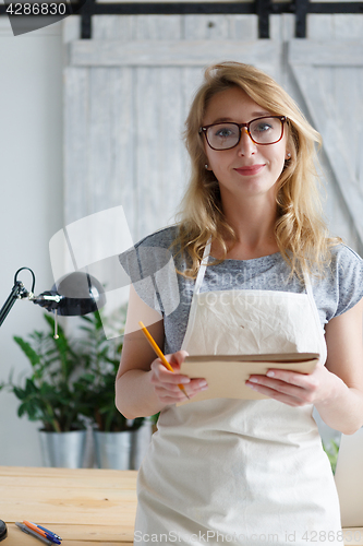 Image of Blonde florist on background flower