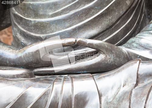 Image of Detail of Buddha statue with Dhyana hand position, the gesture o