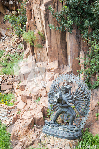 Image of Tantric Deities statue in Ritual Embrace located in a mountain g