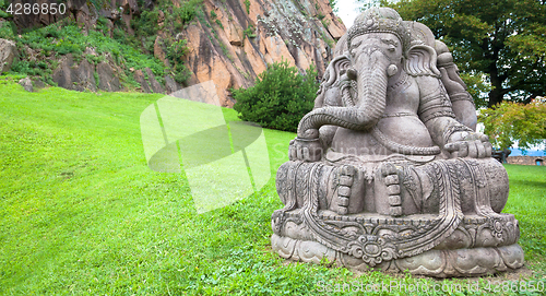 Image of Ganesha statue in a beautiful mountain garden