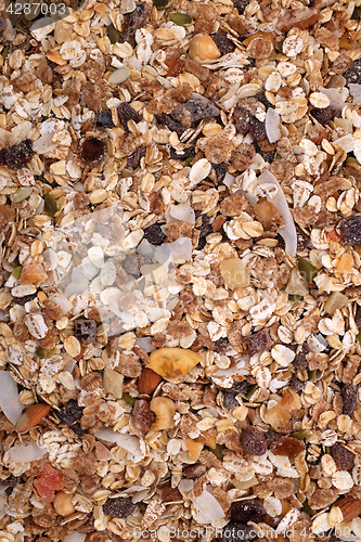 Image of Muesli cereal with seeds, mixed fruit and nuts background