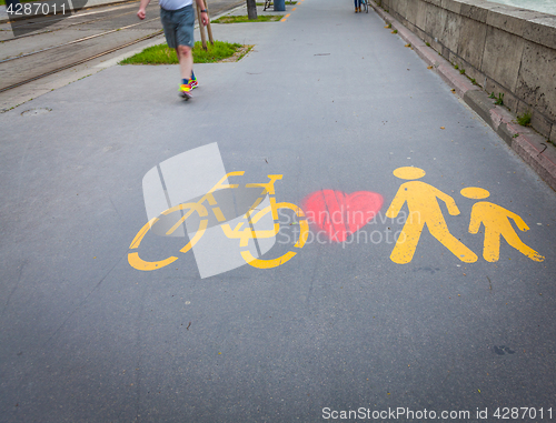 Image of Bicycle signs painted on asphalt