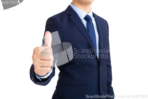 Image of Businessman showing thumb up