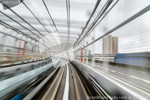Image of Subway tunnel with Motion blur of a city 