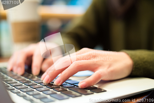 Image of Woman working on laptop computer