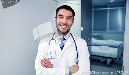 Image of smiling doctor with stethoscope at hospital 