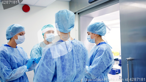 Image of group of surgeons in operating room at hospital