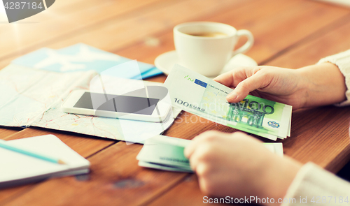 Image of close up of traveler hands counting euro money