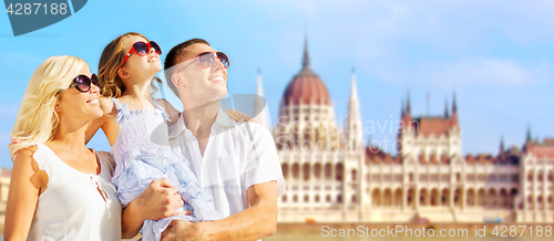 Image of happy family over house of parliament in budapest