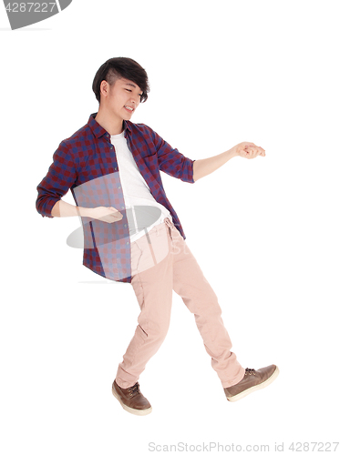 Image of Asian man dancing. 