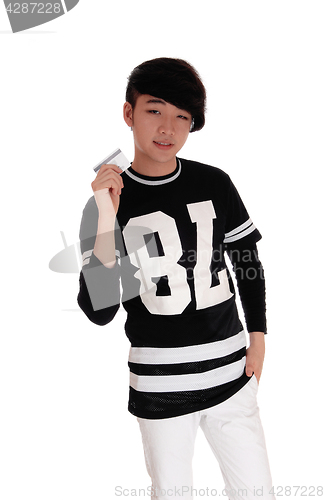 Image of Young man holding a credit card.