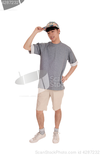 Image of Happy Asian man standing in shorts.