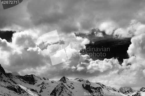 Image of Black and white view on snowy mountains in beautiful clouds