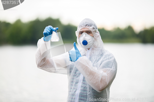 Image of Ecologist raised finger in nature