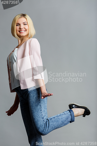 Image of Woman raised leg in studio