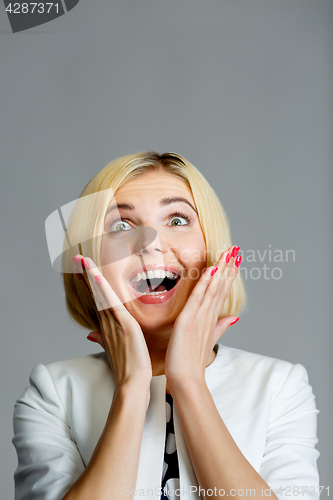 Image of Smiling woman on gray background