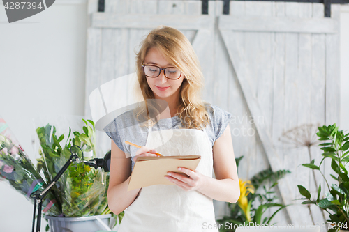 Image of Portrait of young blond florist