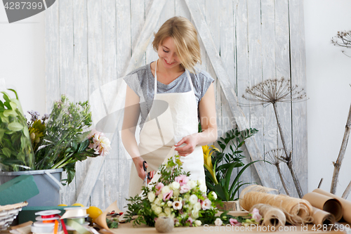 Image of Florist woman with beautiful bouquet